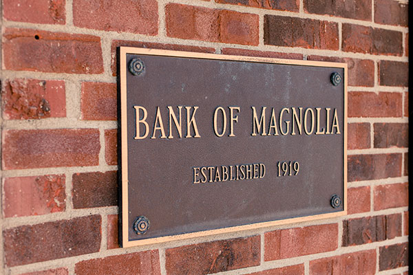 Magnolia Bank plaque on brick wall