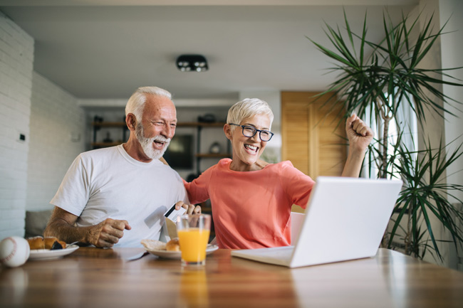 Two people cheering for retirement account