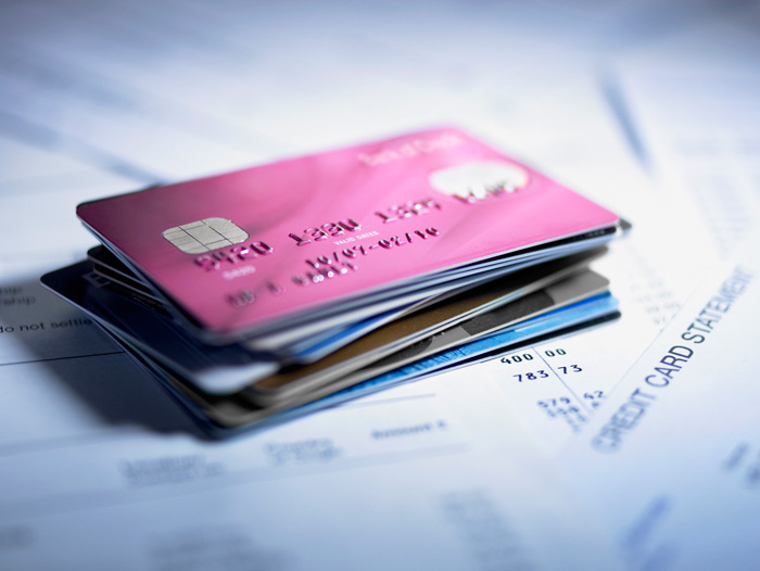 Several credit cards stacked on top of each other, business debit cards