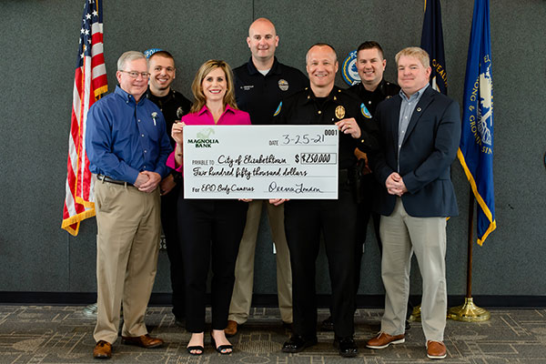 Portrait of 7 people, police officers and magnolia bank employees